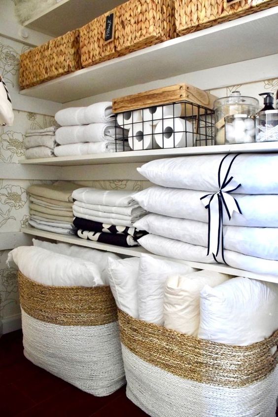https://theiambic.com/wp-content/uploads/2020/08/marie-kondo-folding-towels-1-1.jpg
