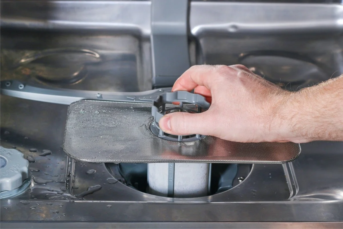 water in bottom of dishwasher when not in use